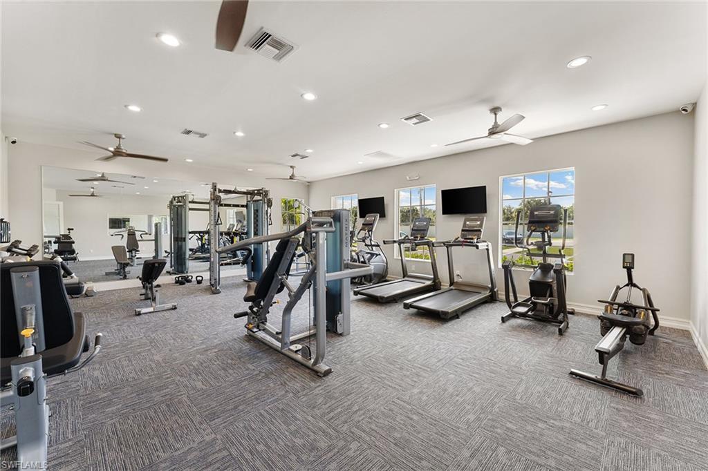 394 Deauville Loop Naples, FL 34114 - Photo 38 of 50 a view of a room with gym equipment