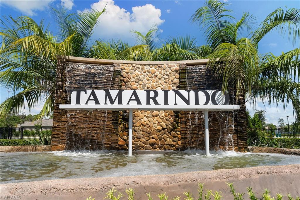 394 Deauville Loop Naples, FL 34114 - Photo 45 of 50 a front view of a house with garden