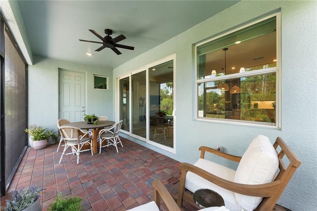 394 Deauville Loop Naples, FL 34114 - Photo 5 of 50 a dining room with furniture and window