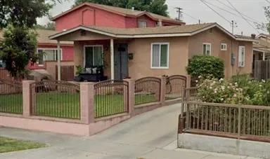 a view of a house with a porch and furniture