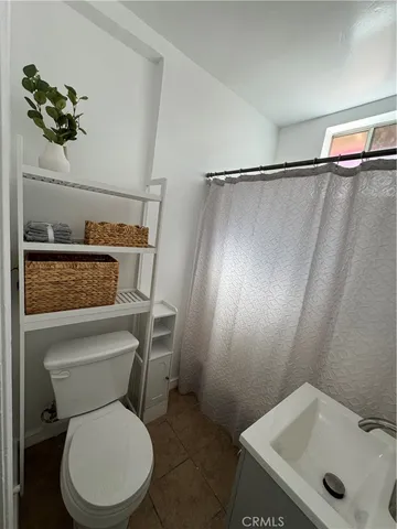 a bathroom with a toilet and a sink