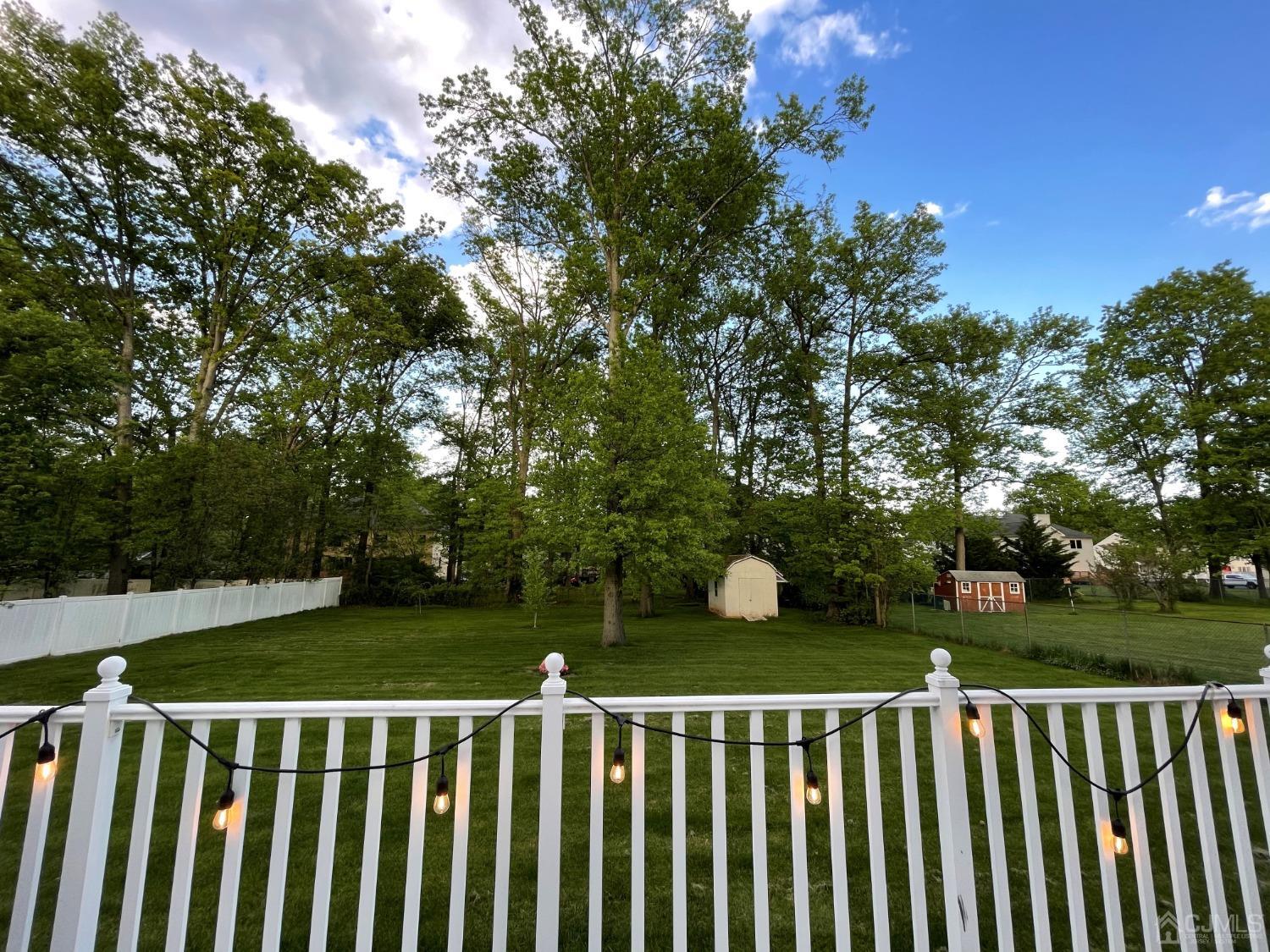 12 Ramsey Road Edison, NJ 08820 - Photo 12 of 30 a view of a wooden fence and trees