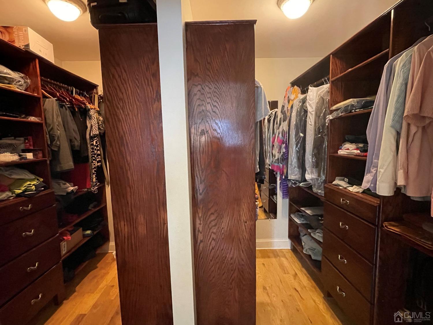12 Ramsey Road Edison, NJ 08820 - Photo 16 of 30 a view of walk in closet with clothes and shoes