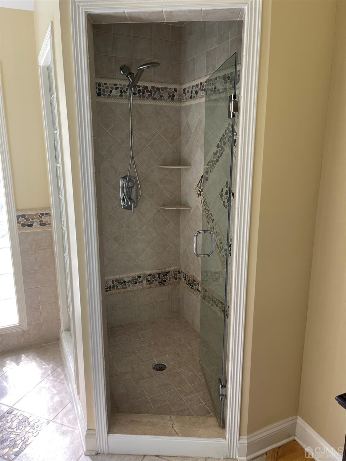 12 Ramsey Road Edison, NJ 08820 - Photo 18 of 30 a bathroom with a glass shower door