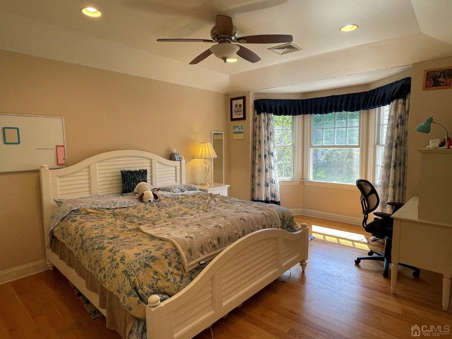 12 Ramsey Road Edison, NJ 08820 - Photo 19 of 30 a bedroom with a bed and wooden floor