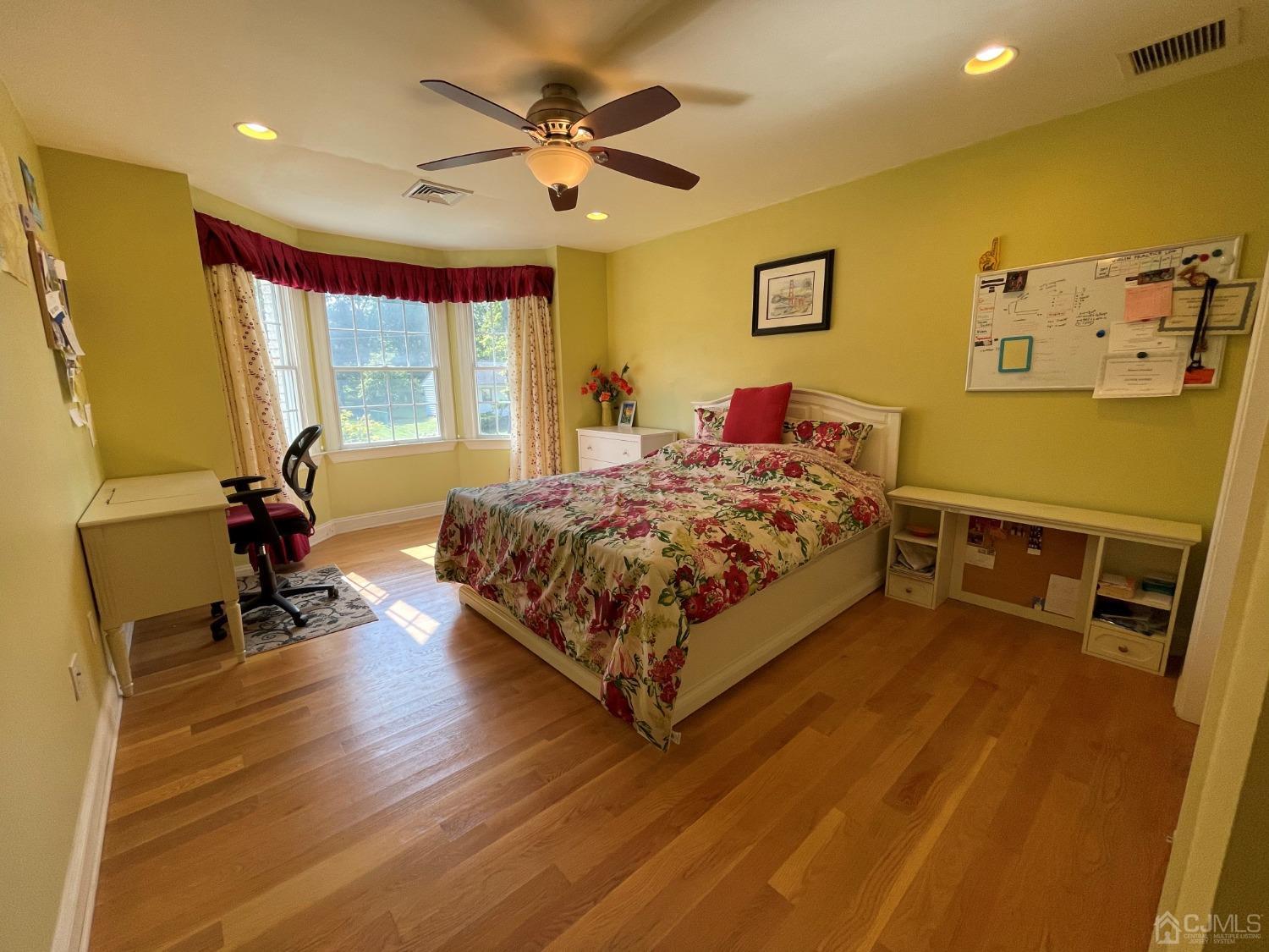 12 Ramsey Road Edison, NJ 08820 - Photo 20 of 30 a bedroom with a bed and wooden floor