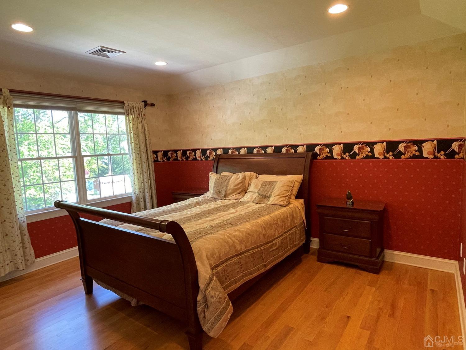 12 Ramsey Road Edison, NJ 08820 - Photo 21 of 30 a bed room with a bed and a chair