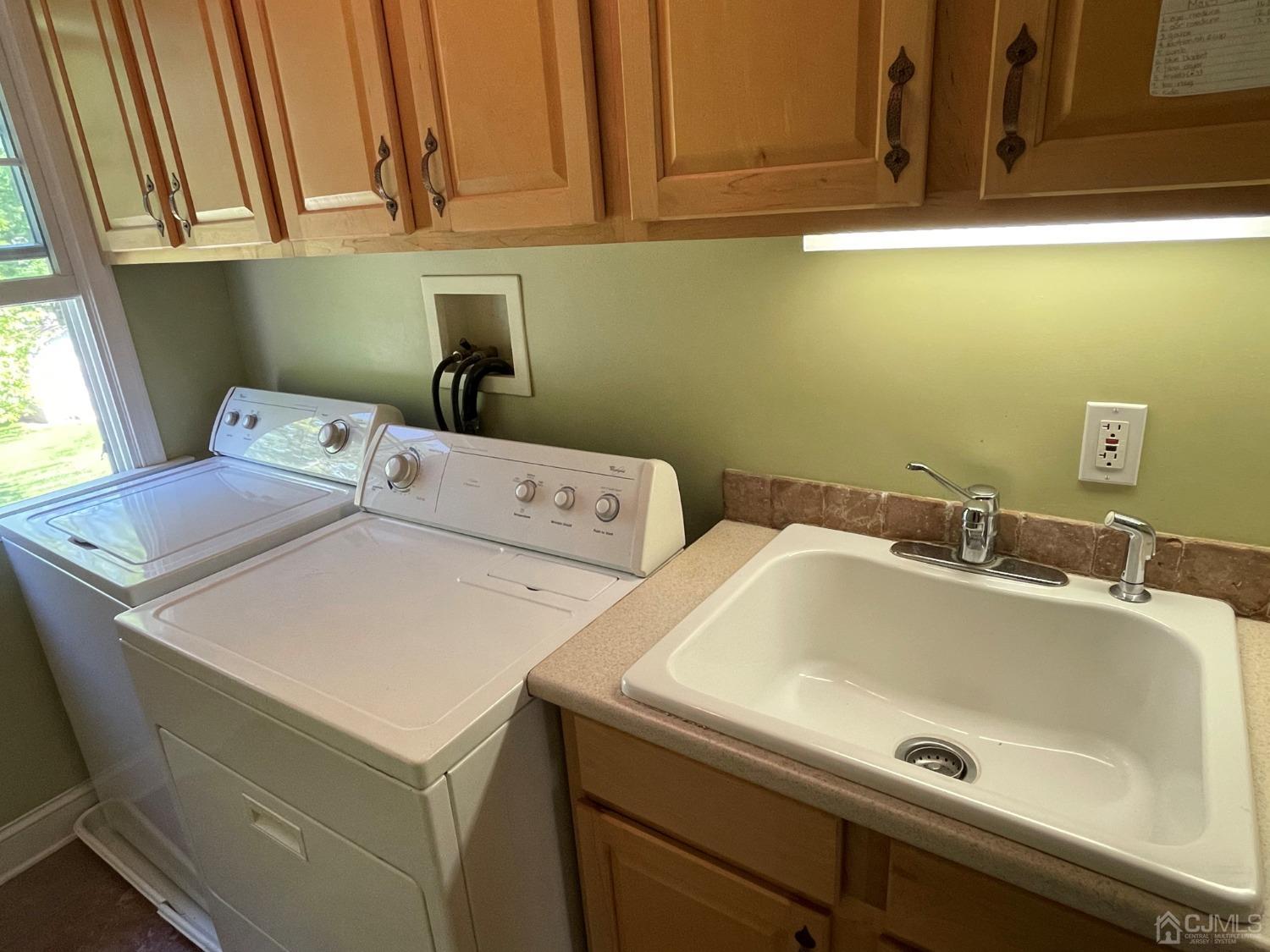 12 Ramsey Road Edison, NJ 08820 - Photo 24 of 30 a utility room with dryer and washer