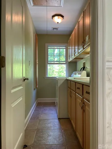 a bathroom with a sink a vanity and a mirror