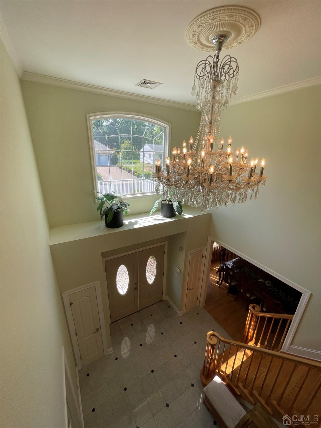 12 Ramsey Road Edison, NJ 08820 - Photo 4 of 30 a view of a dining room with furniture and chandelier