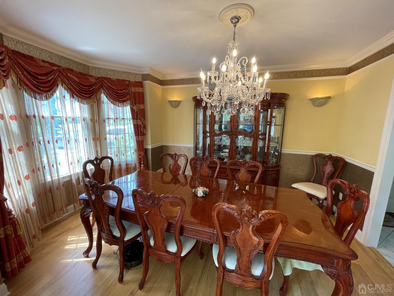 12 Ramsey Road Edison, NJ 08820 - Photo 6 of 30 a view of a dining room with furniture and chandelier