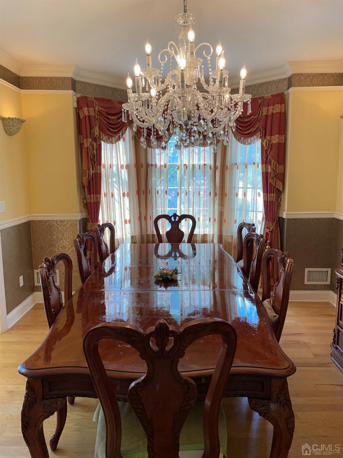 12 Ramsey Road Edison, NJ 08820 - Photo 7 of 30 a view of a dining room with furniture and chandelier
