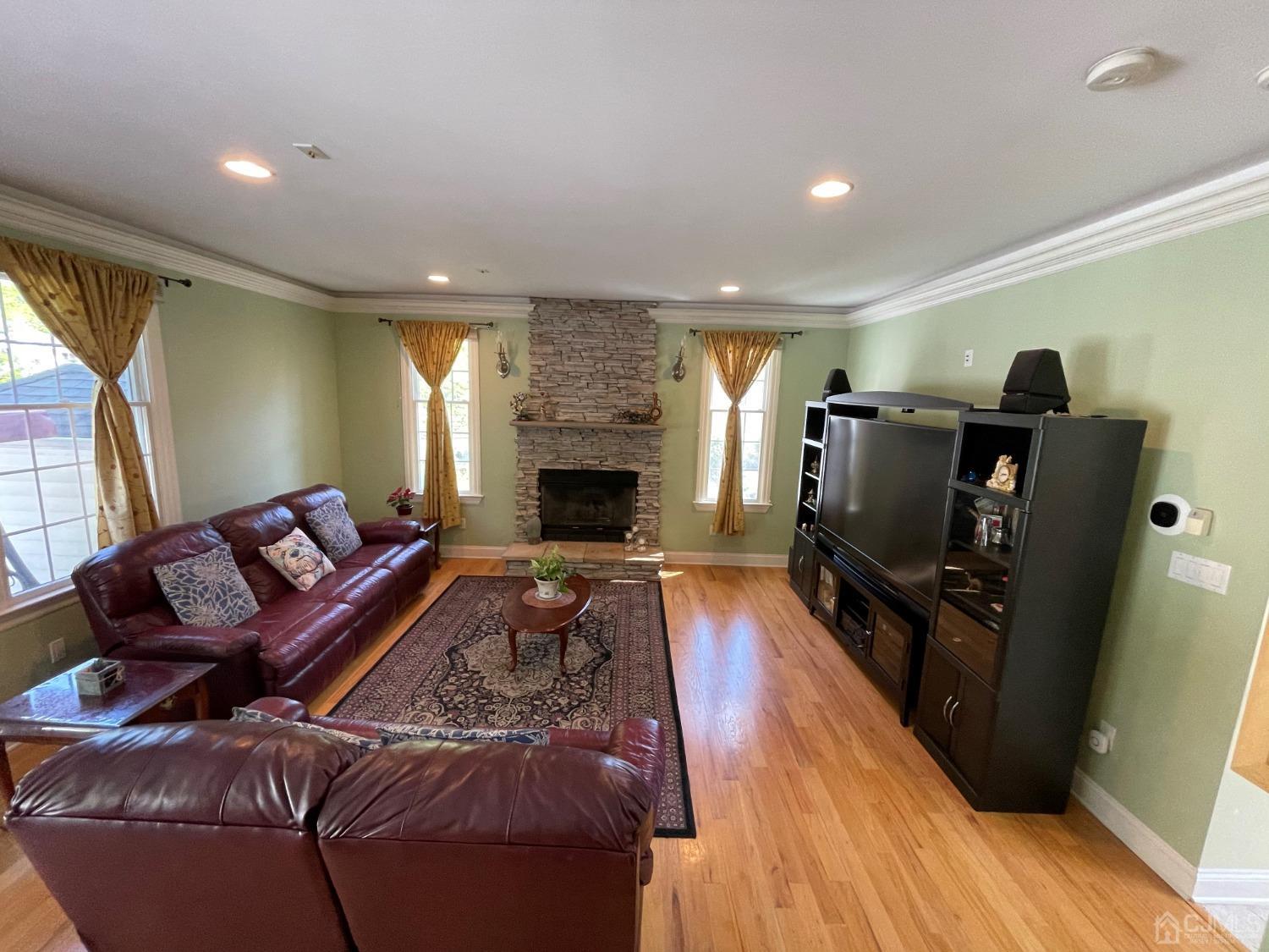 12 Ramsey Road Edison, NJ 08820 - Photo 8 of 30 a living room with furniture and a flat screen tv