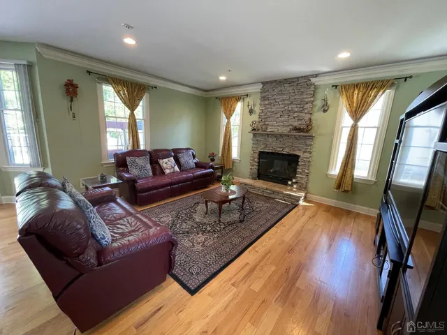 a living room with furniture and a fireplace