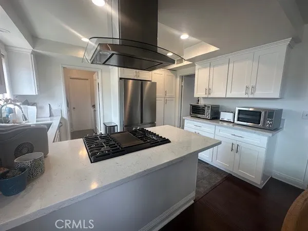 a kitchen with stainless steel appliances a sink stove and refrigerator