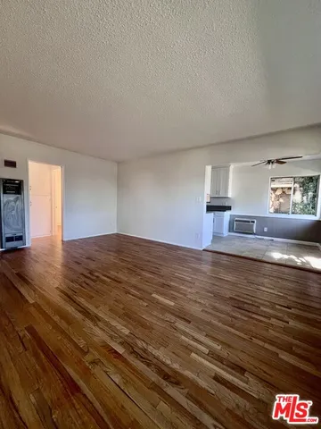 a view of kitchen and empty room