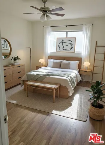a bedroom with a bed and window