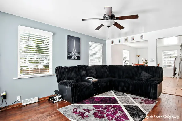 a living room with furniture rug and window