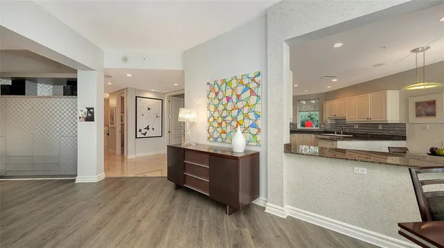 a bathroom with a bathtub sink mirror vanity and toilet