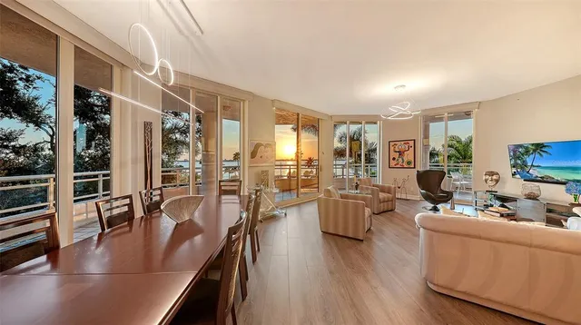 a living room with furniture and a book shelf