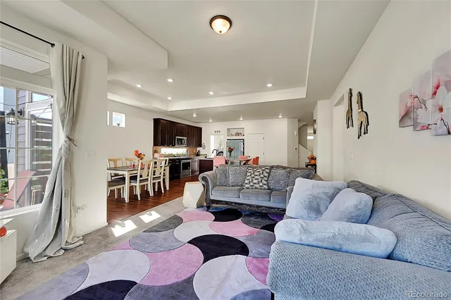 a living room with furniture and a table