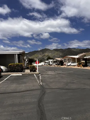 a view of swimming pool with building in the background