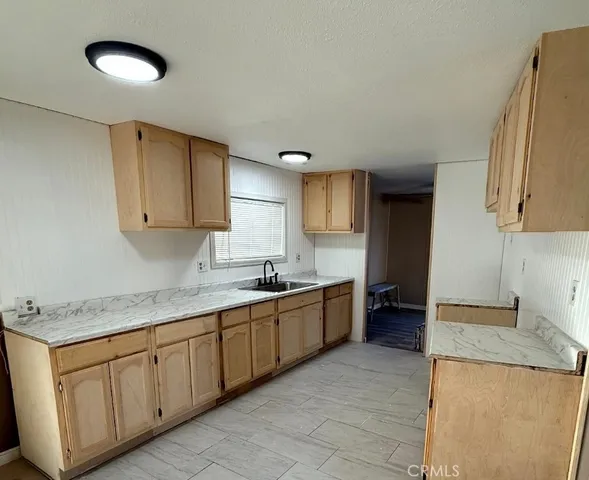 a stove top oven sitting inside of a kitchen