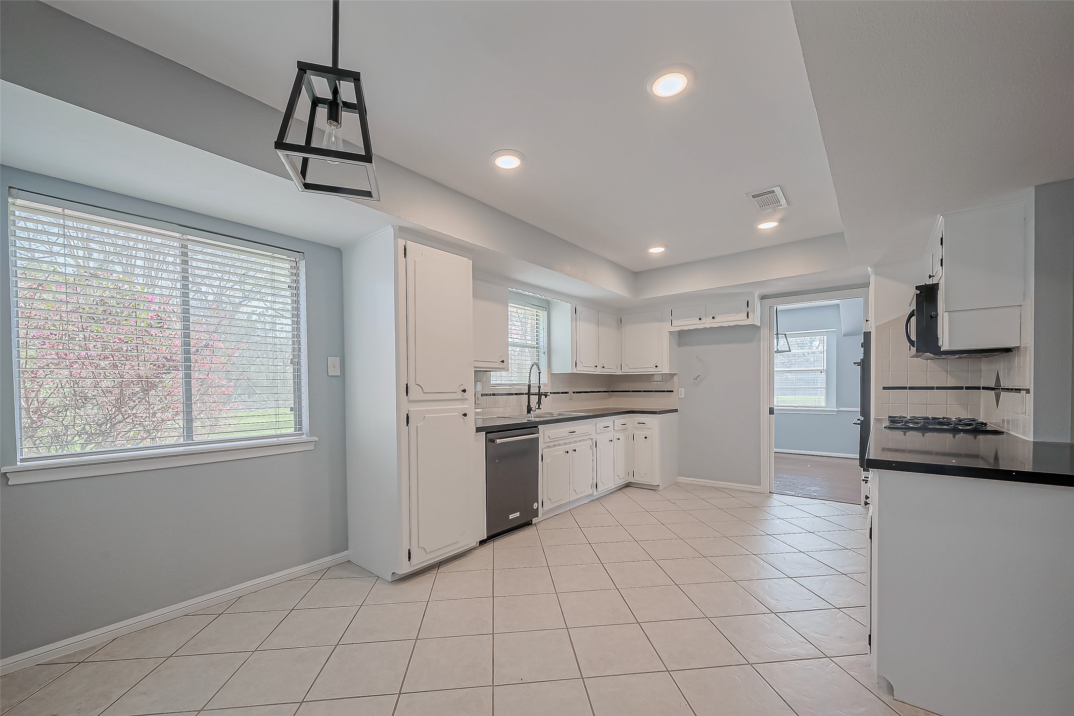 16506 Amcreek Road Houston, TX 77068 - Photo 14 of 50 a large kitchen with cabinets and stainless steel appliances
