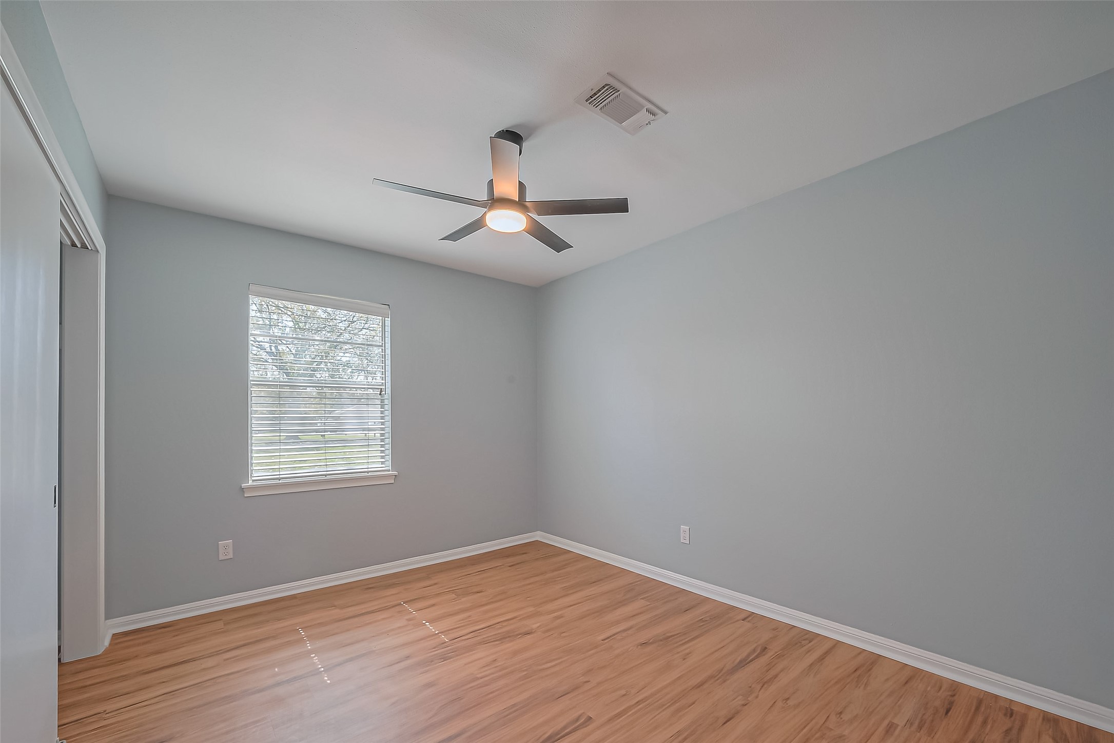 16506 Amcreek Road Houston, TX 77068 - Photo 22 of 50 wooden floor in an empty room with a window