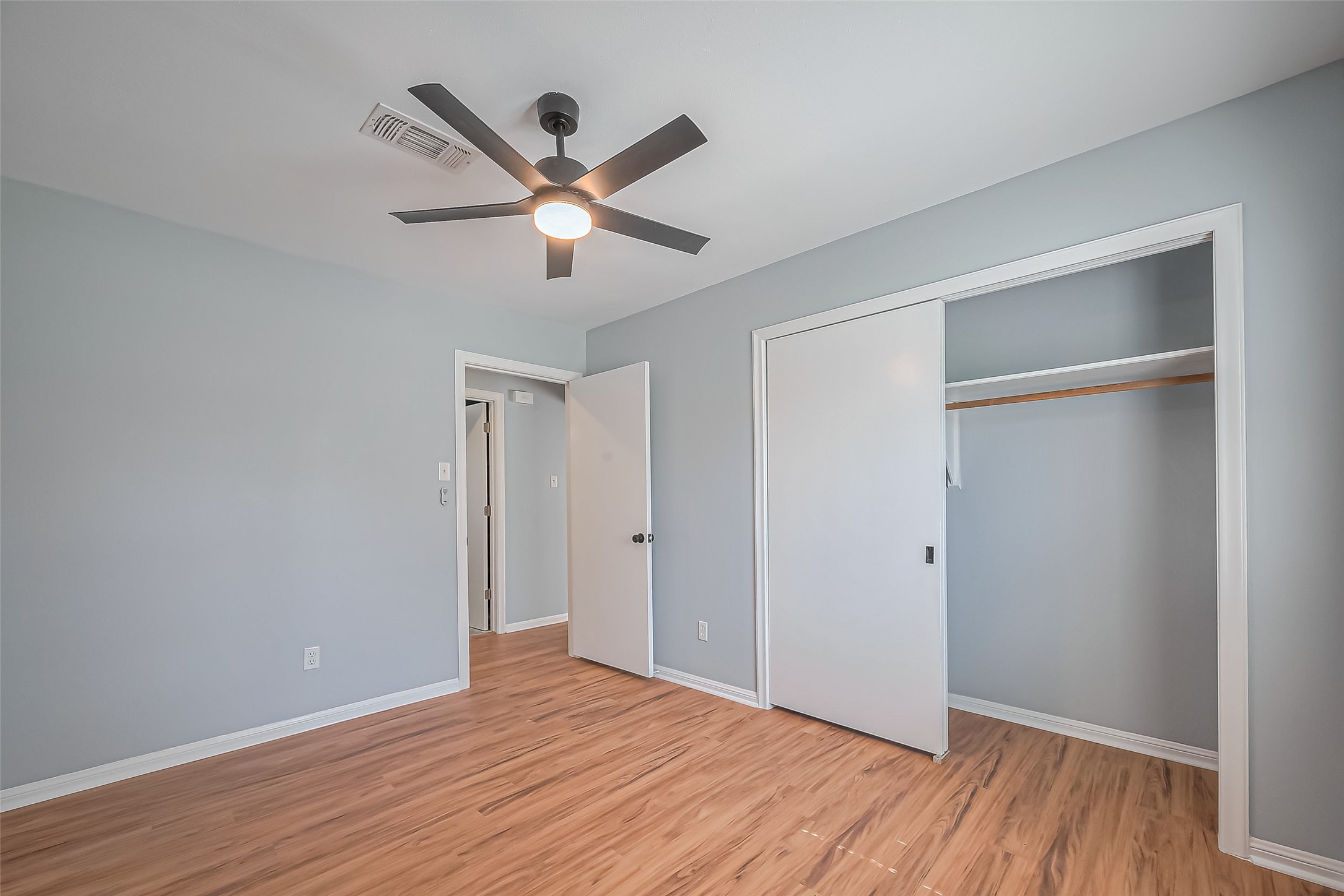 16506 Amcreek Road Houston, TX 77068 - Photo 23 of 50 a view of empty room with wooden floor