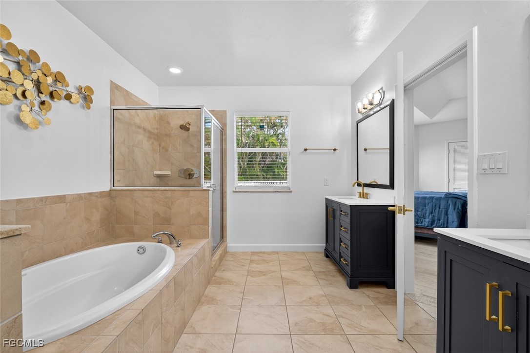 13570 Harbour Ridge Drive Fort Myers, FL 33908 - Photo 29 of 50 a bathroom with a bathtub sink and mirror