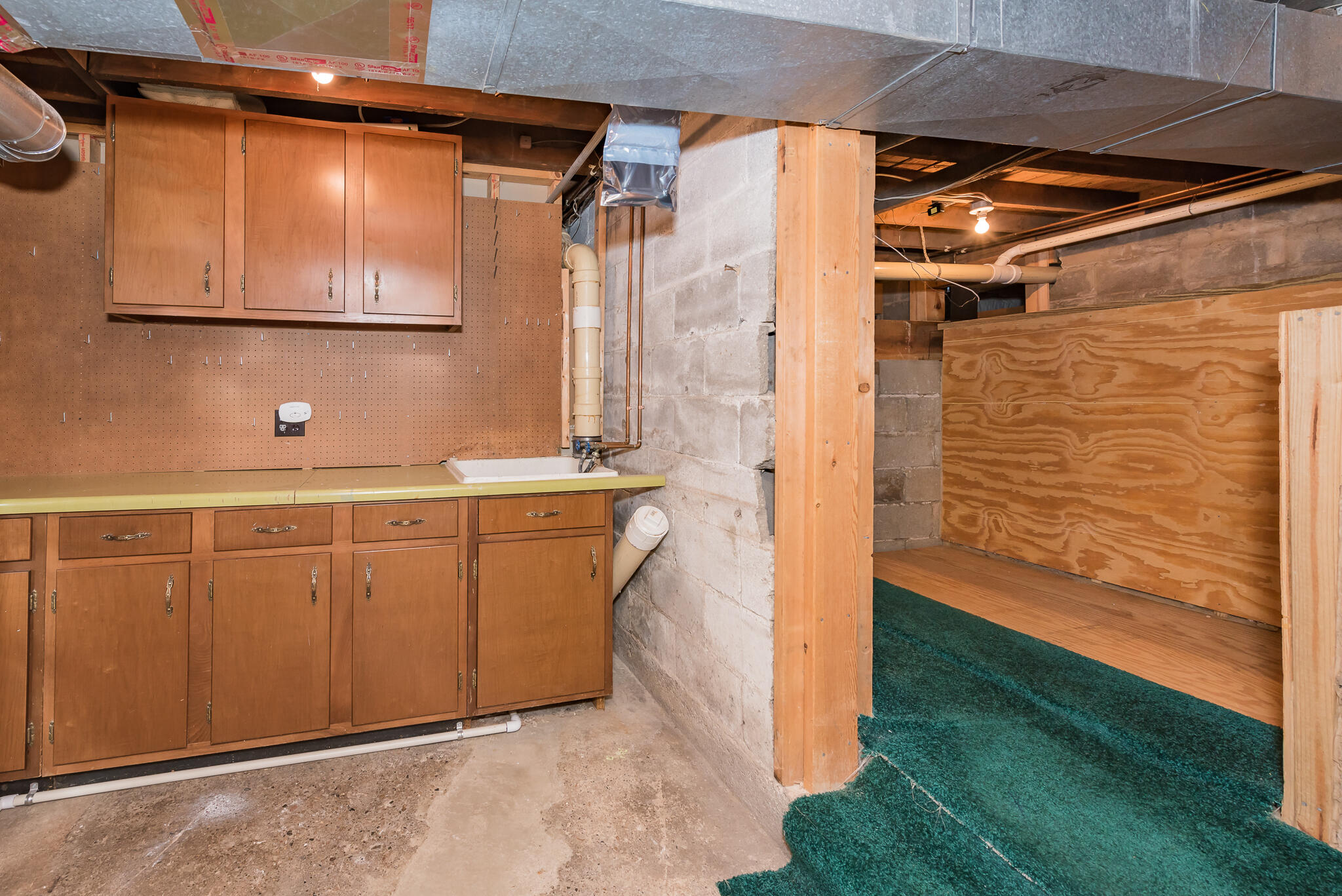 2630 Baldwin Street Jenison, MI 49428 - Photo 49 of 62 Workbench/Crawl Space Storage