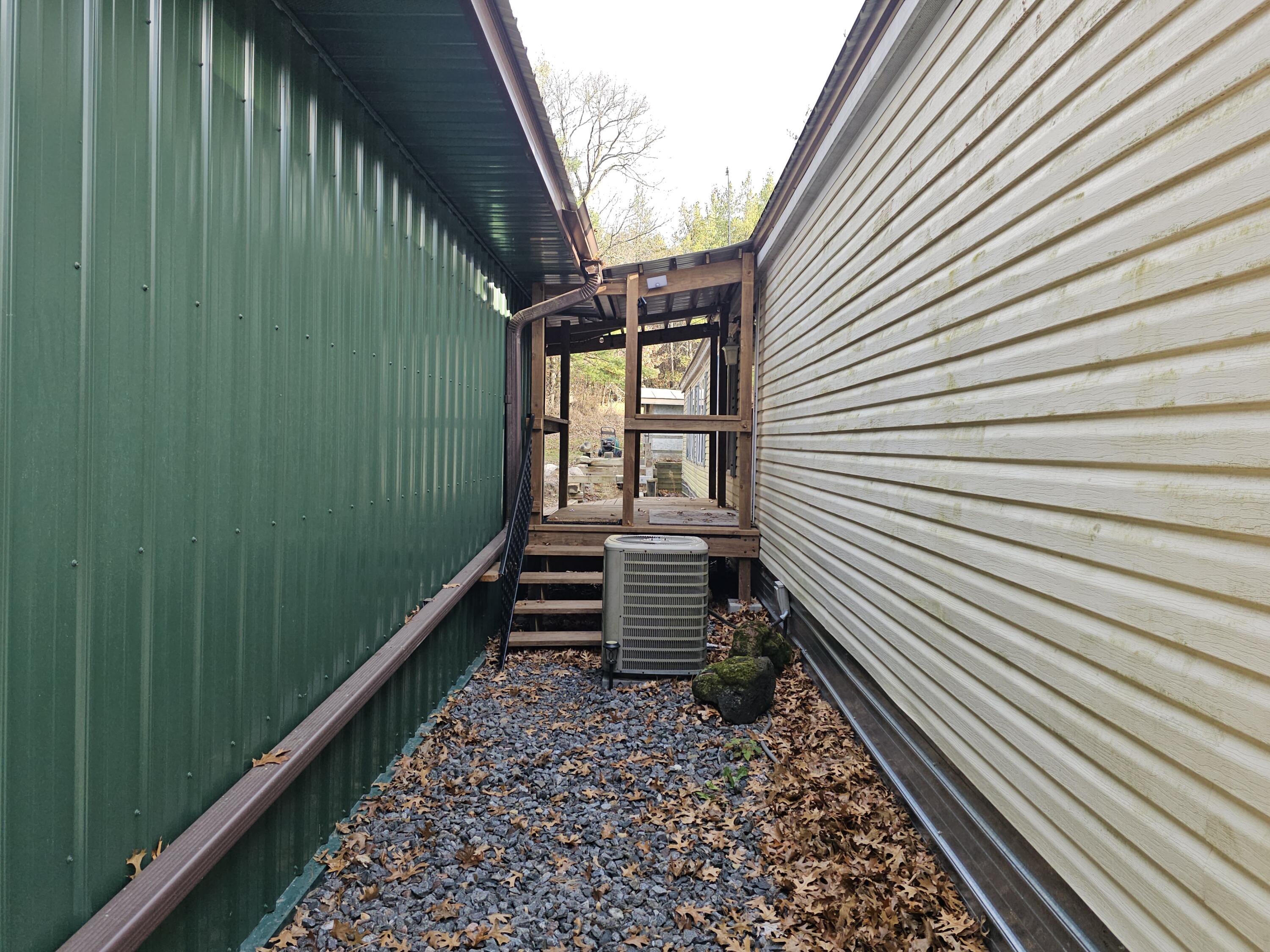 2026 Highway 71 Little Falls, WI 54656 - Photo 2 of 43 Breezeway between house and garage