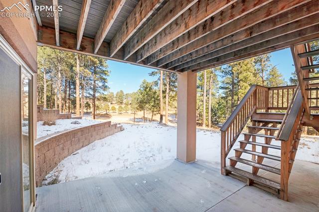 6980 Wildridge Road Colorado Springs, CO 80908 - Photo 20 of 26 Walk out from the basement to covered patio