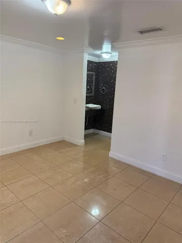 a bathroom with a sink a toilet a shower and a large mirror