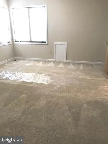 a view of a room that has a window