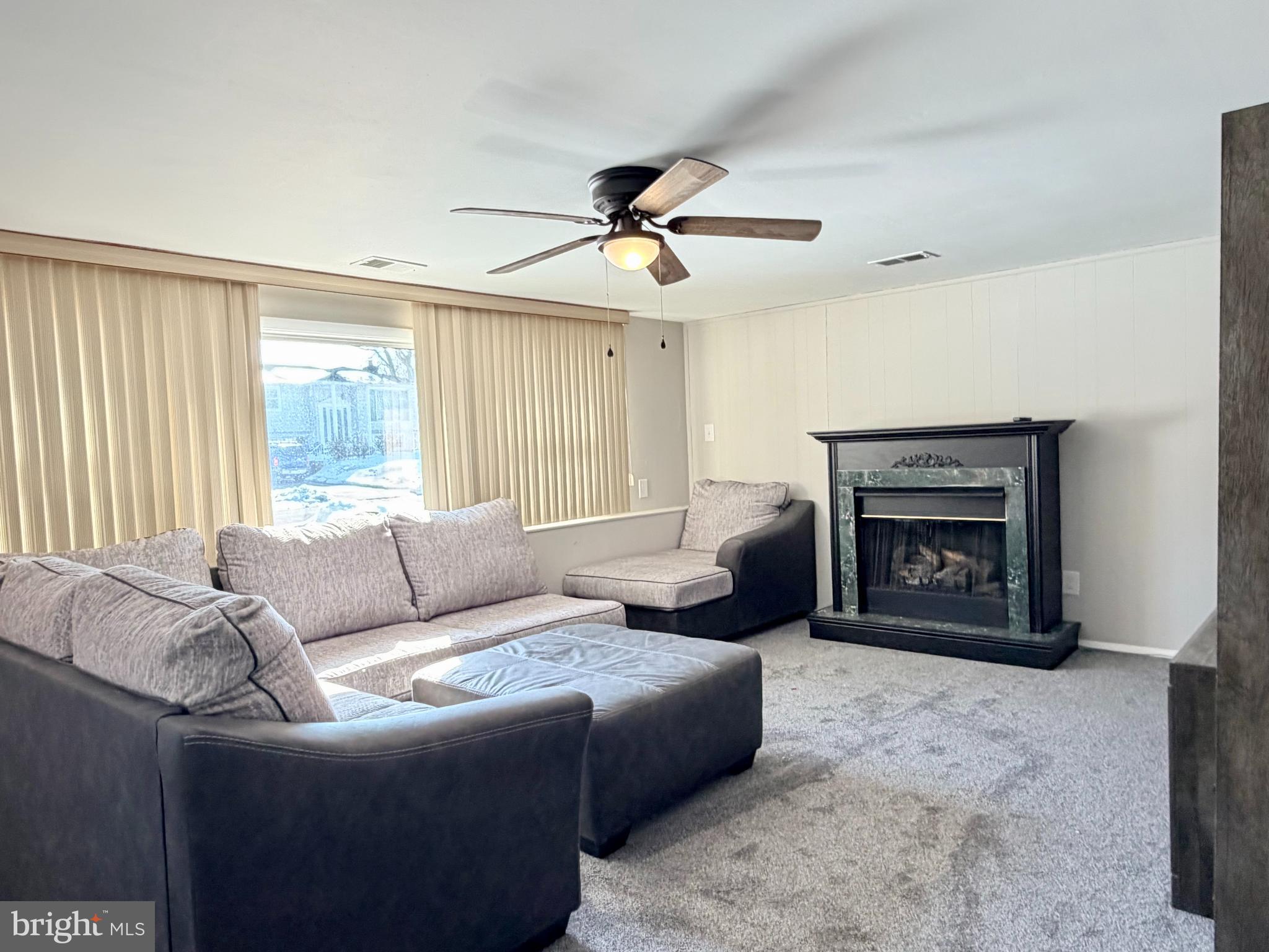 23 Lehigh Drive Delran, NJ 08075 - Photo 3 of 22 a living room with furniture and a fireplace