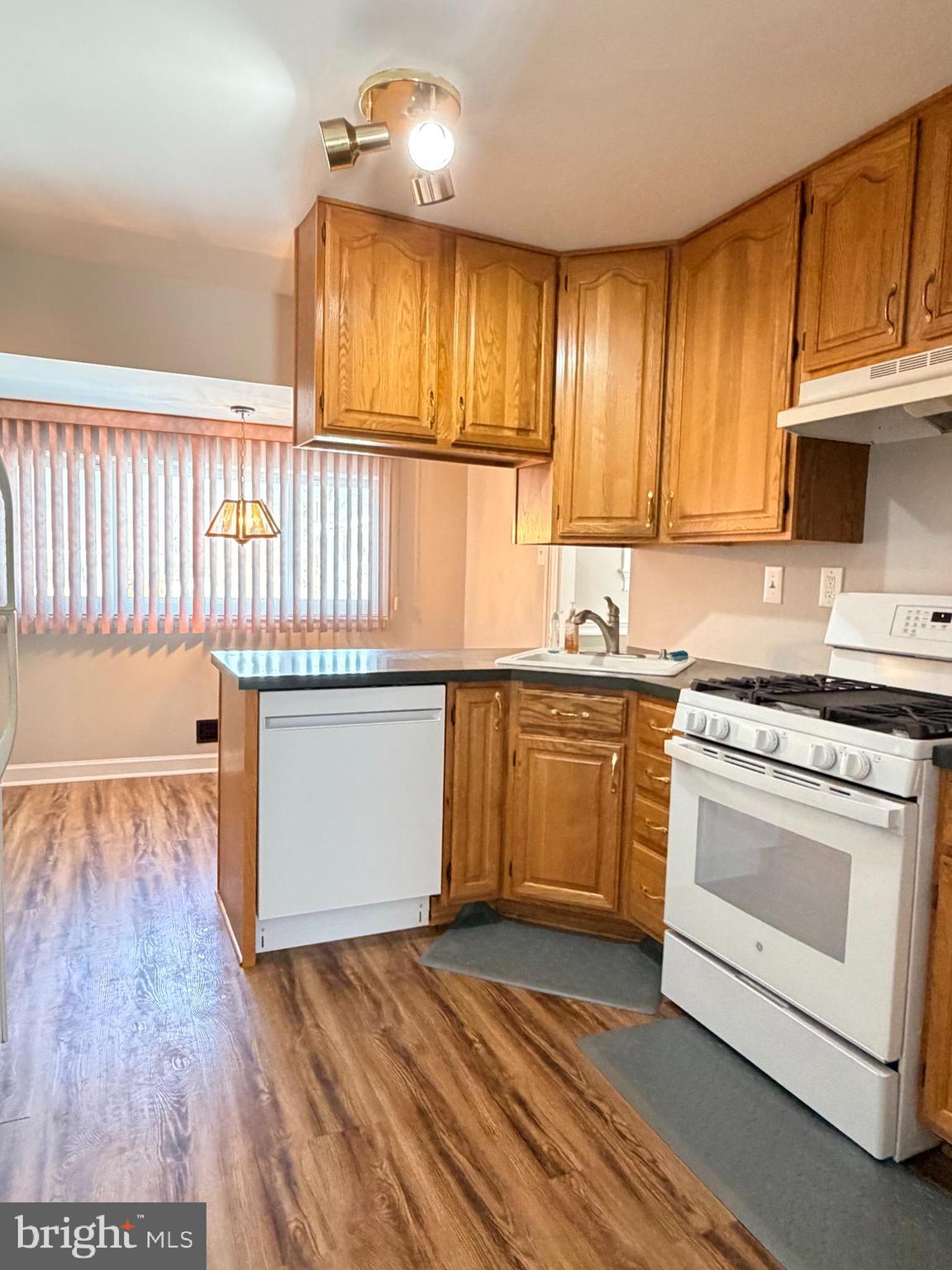 23 Lehigh Drive Delran, NJ 08075 - Photo 7 of 22 a kitchen with a sink stove and cabinets