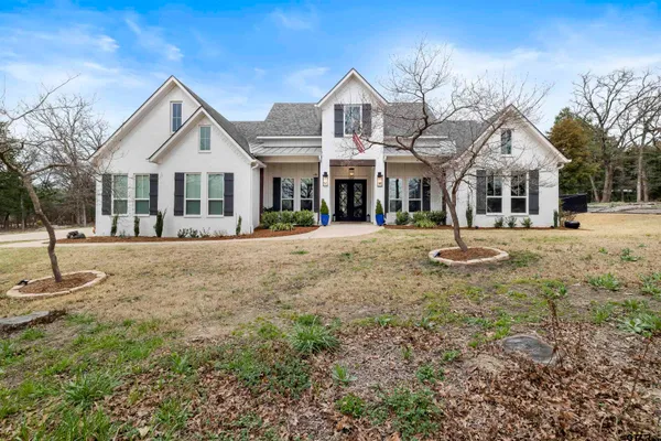 a living room with furniture and a piano