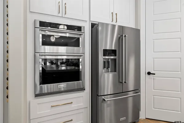 a view of a dining room with furniture wooden floor and chandelier