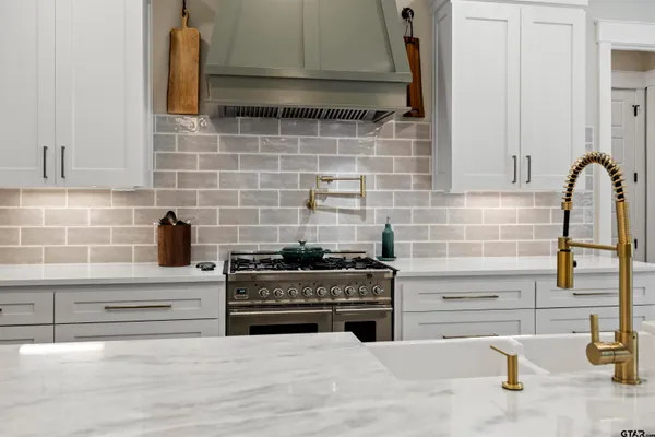 a bathroom with mirror and window