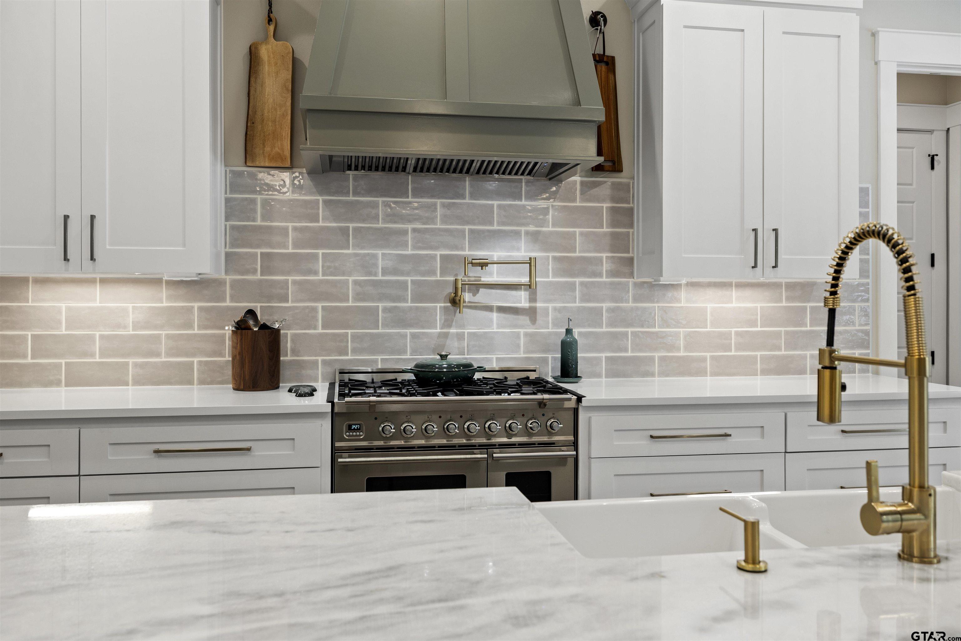 23316 Fm 1995 Lindale, TX 75771 - Photo 13 of 47 a kitchen with granite countertop a stove and a sink