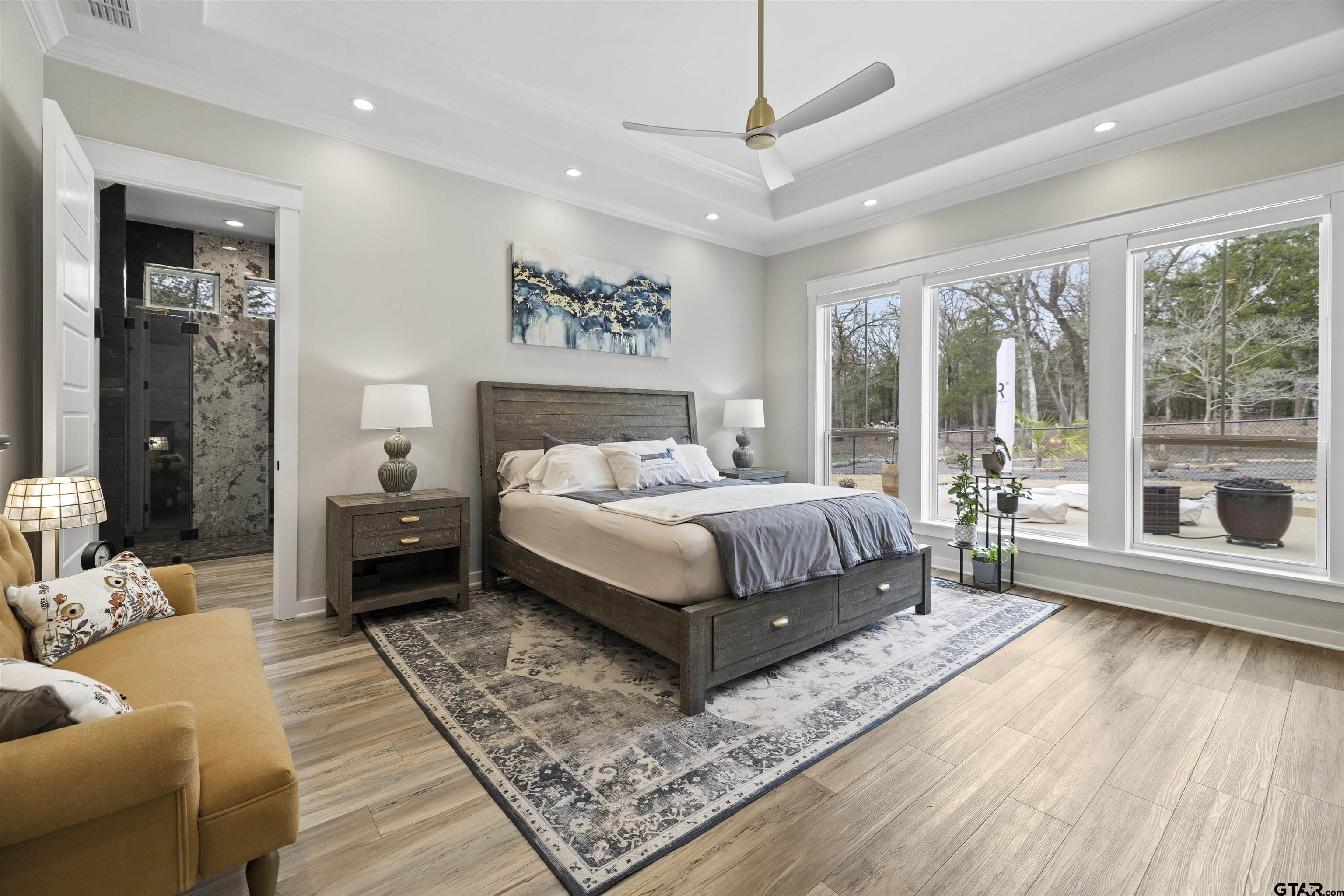 23316 Fm 1995 Lindale, TX 75771 - Photo 16 of 47 a bedroom with a large bed a rug and windows