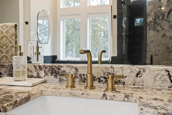 a view of a hallway with wooden floor and closet