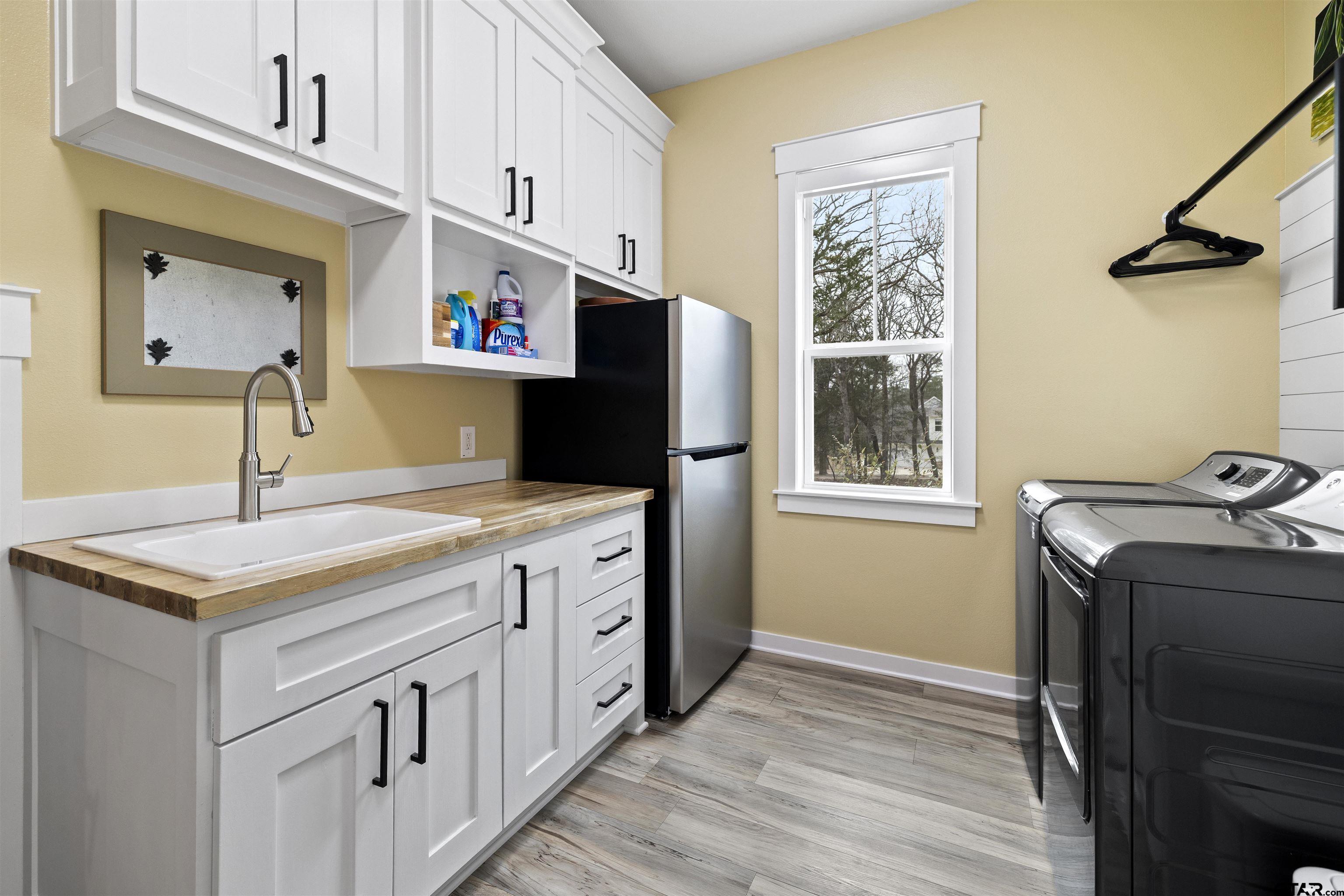 23316 Fm 1995 Lindale, TX 75771 - Photo 22 of 47 a kitchen with stainless steel appliances granite countertop a refrigerator and a sink