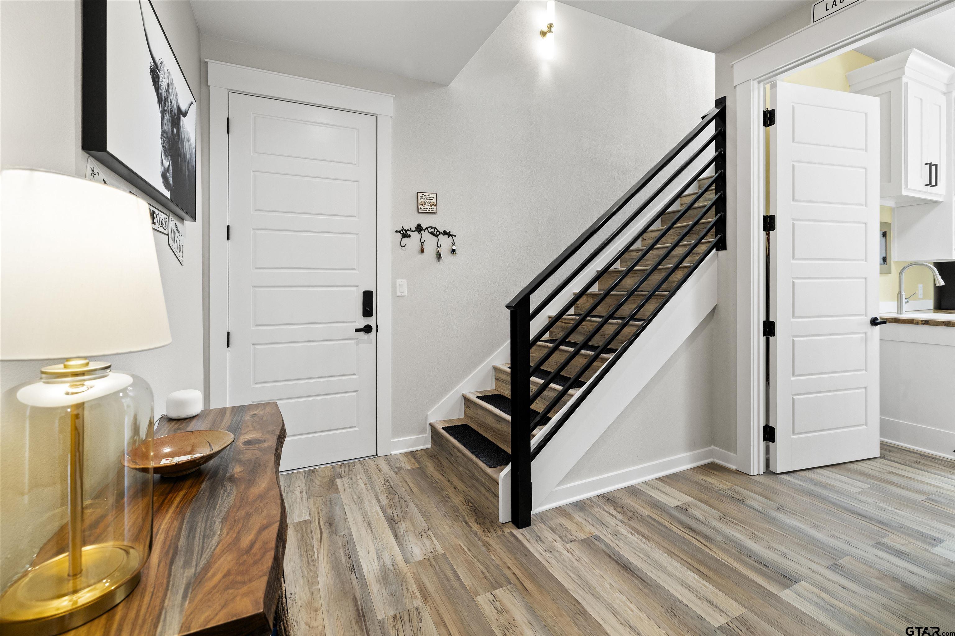 23316 Fm 1995 Lindale, TX 75771 - Photo 23 of 47 a view of a hallway with wooden floor and staircase