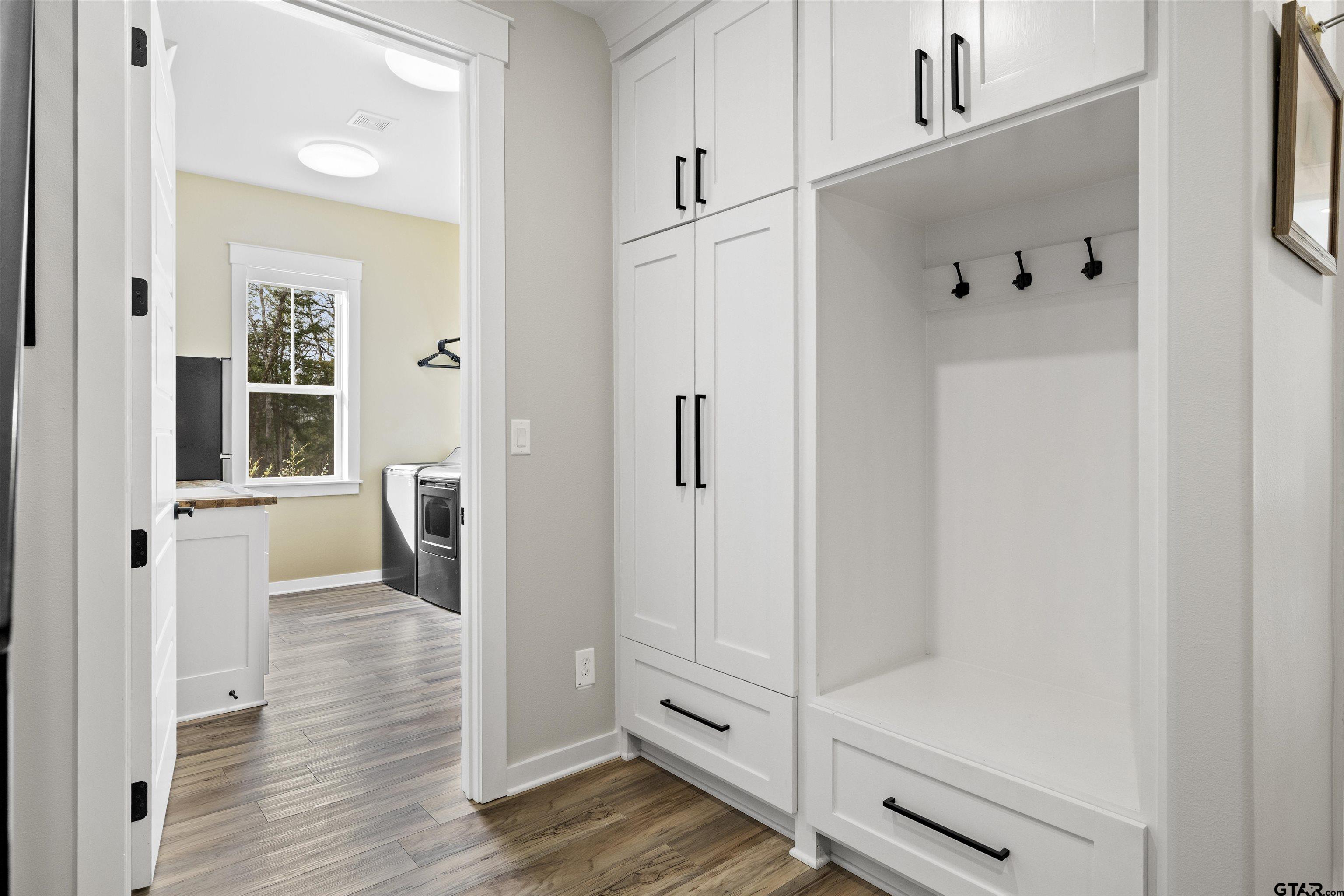23316 Fm 1995 Lindale, TX 75771 - Photo 24 of 47 a view of a hallway with wooden floor and closet