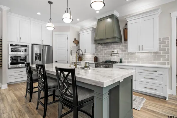 a kitchen with granite countertop a stove and a sink