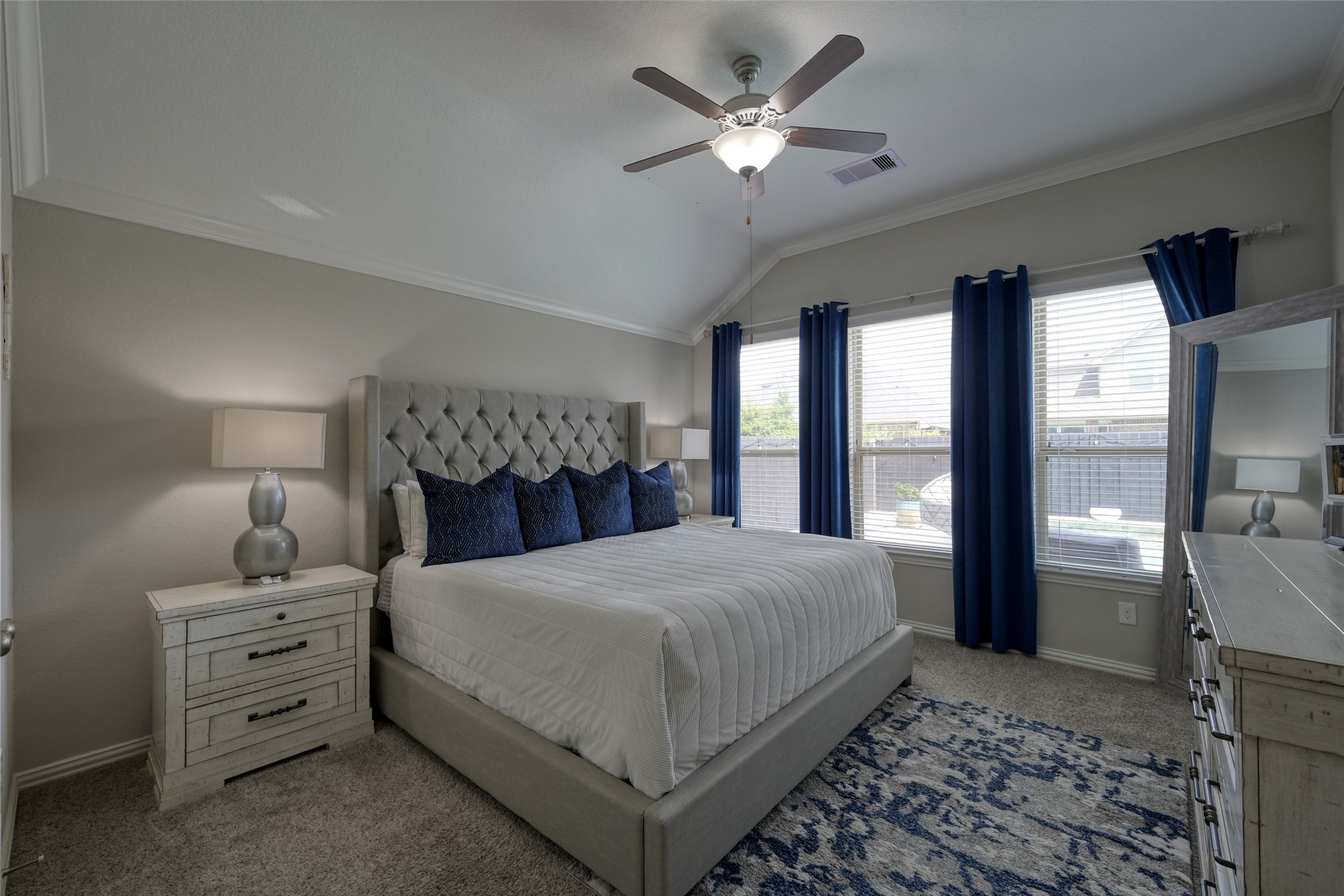 3465 Stablewood Grove Lane Spring, TX 77386 - Photo 15 of 50 a bedroom with a large bed and a chandelier