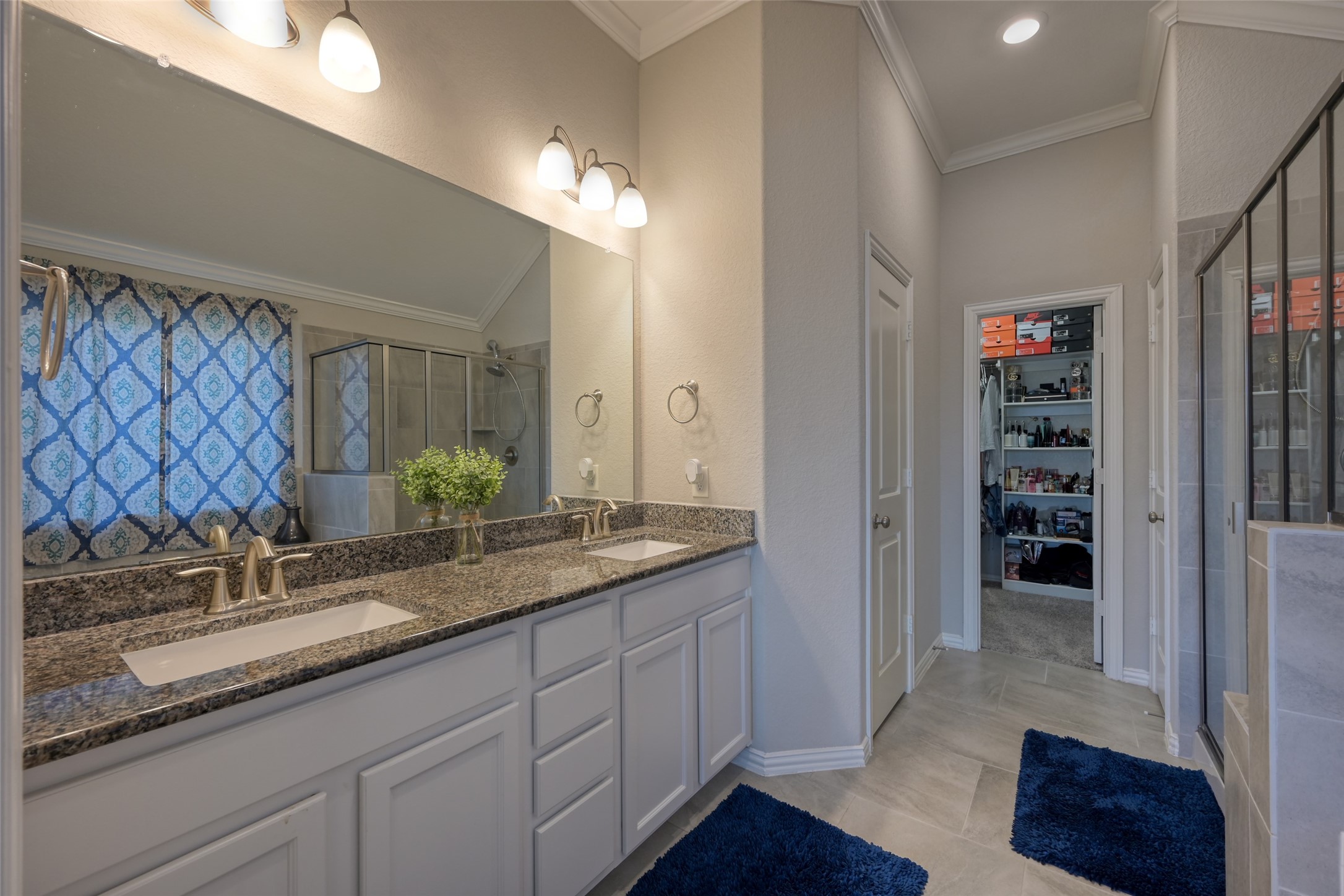 3465 Stablewood Grove Lane Spring, TX 77386 - Photo 18 of 50 a bathroom with a granite countertop double vanity sink a mirror and a